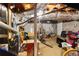 Unfinished basement with exposed ducts, concrete floor, and storage items at 984 Ridgecrest Se Dr, Smyrna, GA 30080