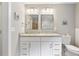 Bright bathroom with double vanity and granite countertop, offering ample space and style at 984 Ridgecrest Se Dr, Smyrna, GA 30080