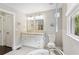 Bright bathroom with double vanity and granite countertop, offering ample space and style at 984 Ridgecrest Se Dr, Smyrna, GA 30080