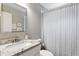 Classic bathroom featuring a granite-topped vanity and shower with curtain at 984 Ridgecrest Se Dr, Smyrna, GA 30080