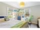 Bright bedroom with white iron bedframe, shelving, and modern decor at 984 Ridgecrest Se Dr, Smyrna, GA 30080