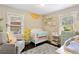 Inviting Bedroom with charming sunflower decals and lots of natural light at 984 Ridgecrest Se Dr, Smyrna, GA 30080