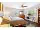 Cozy bedroom filled with natural light, a ceiling fan, and hardwood floors at 984 Ridgecrest Se Dr, Smyrna, GA 30080