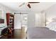 Inviting bedroom showcasing hardwood floors, a ceiling fan, and a sliding barn door at 984 Ridgecrest Se Dr, Smyrna, GA 30080