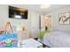 Well-lit bedroom with TV, white trim, and neutral color palette at 984 Ridgecrest Se Dr, Smyrna, GA 30080