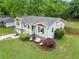 Aerial view of charming house with green lawn, swing and mature trees at 984 Ridgecrest Se Dr, Smyrna, GA 30080