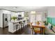 Modern kitchen with stainless steel appliances, granite countertops, and an adjacent dining area at 984 Ridgecrest Se Dr, Smyrna, GA 30080