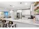 Open-concept kitchen with granite countertops, stainless steel appliances, and eat-in bar seating at 984 Ridgecrest Se Dr, Smyrna, GA 30080