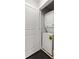 Convenient laundry room features a stacked washer and dryer at 984 Ridgecrest Se Dr, Smyrna, GA 30080