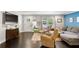 Inviting living room with hardwood floors, modern decor, and comfortable seating area at 984 Ridgecrest Se Dr, Smyrna, GA 30080