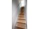 Bright stairway leading upstairs with a window providing natural light at 11606 E Lovejoy Rd, Hampton, GA 30228
