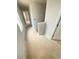 Bright hallway featuring neutral walls and doorways leading to various rooms at 11608 E Lovejoy Rd, Hampton, GA 30228