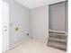 A gray basement with tile flooring and carpeted stairs at 1463 Shadowrock Hts, Marietta, GA 30062