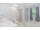 Bathroom featuring dual sinks, a separate shower, and a luxurious soaking tub at 1463 Shadowrock Hts, Marietta, GA 30062