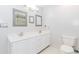 Bathroom featuring dual sinks, vanity and ample lighting at 1463 Shadowrock Hts, Marietta, GA 30062