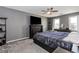 Bedroom with ceiling fan featuring a decorative fireplace and neutral walls at 1463 Shadowrock Hts, Marietta, GA 30062