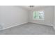 Bedroom features neutral paint and carpet, a window overlooking the backyard, and inset ceiling lighting at 1463 Shadowrock Hts, Marietta, GA 30062