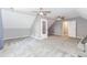 This bonus room has neutral walls, carpet flooring, two ceiling fans and a closet at 1463 Shadowrock Hts, Marietta, GA 30062
