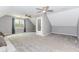 This bonus room has neutral walls, carpet flooring, two ceiling fans and a window at 1463 Shadowrock Hts, Marietta, GA 30062