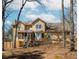 Back of home with a nice deck, bay window, and landscaped yard with mature trees at 1463 Shadowrock Hts, Marietta, GA 30062