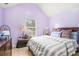 Cozy bedroom with a large window and vaulted ceilings at 436 Berkshire Pl, Fairburn, GA 30213