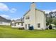 Exterior view of the home and well-maintained backyard at 436 Berkshire Pl, Fairburn, GA 30213