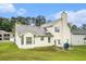 Exterior shot of back of home with lawn and mature trees at 436 Berkshire Pl, Fairburn, GA 30213