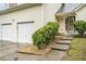 Inviting front entrance with steps leading to the front door, flanked by lush greenery at 436 Berkshire Pl, Fairburn, GA 30213