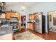 Charming kitchen features stainless steel appliances, wooden cabinets, and hardwood floors at 436 Berkshire Pl, Fairburn, GA 30213
