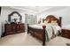 Spacious main bedroom features elegant furnishings and soft natural light at 436 Berkshire Pl, Fairburn, GA 30213