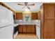 Functional kitchen with stainless steel sink, appliances, and wood cabinetry at 6139 Keswick Row, Tucker, GA 30084
