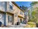 Rear view of townhomes features a patio and wooded views from the backyard at 5800 Oakdale Se Rd # 147, Mableton, GA 30126