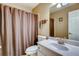 Bathroom with tub and shower combination and white single sink vanity at 5800 Oakdale Se Rd # 147, Mableton, GA 30126