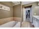 Well-lit bathroom with a soaking tub and a separate shower at 5800 Oakdale Se Rd # 147, Mableton, GA 30126