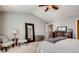 Spacious primary bedroom featuring a ceiling fan and cozy sitting area at 5800 Oakdale Se Rd # 147, Mableton, GA 30126