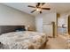 Spacious bedroom featuring neutral walls, ceiling fan, and carpeted floor at 5800 Oakdale Se Rd # 147, Mableton, GA 30126
