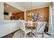 Cozy dining area with a round wooden table, upholstered chairs, and stylish decor in an inviting setting at 5800 Oakdale Se Rd # 147, Mableton, GA 30126