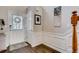 Elegant foyer featuring hardwood floors, decorative trim, and a staircase leading to the upper level at 5800 Oakdale Se Rd # 147, Mableton, GA 30126