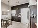 Clean and practical kitchen eating area with modern appliances, sleek stainless refrigerator, and a black accent wall at 5800 Oakdale Se Rd # 147, Mableton, GA 30126