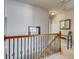 Stairway landing area with wood banister and view of decor and hallway at 5800 Oakdale Se Rd # 147, Mableton, GA 30126