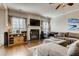 Bright and spacious living room featuring a fireplace, hardwood floors, and a cozy seating area at 5800 Oakdale Se Rd # 147, Mableton, GA 30126