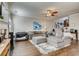 Open-concept living room with hardwood floors, a fireplace, and seamless flow into the dining area at 5800 Oakdale Se Rd # 147, Mableton, GA 30126