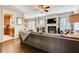 Cozy living room with a fireplace, hardwood floors, and open access to the dining area and kitchen at 5800 Oakdale Se Rd # 147, Mableton, GA 30126
