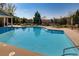 A pristine community pool is surrounded by plenty of lounge chairs and tables at 5800 Oakdale Se Rd # 147, Mableton, GA 30126