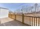 The wooden back deck overlooks the backyard and green space at 1258 Ainsworth Aly # 46, Sugar Hill, GA 30518