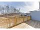 The wooden back deck overlooks the backyard and green space at 1258 Ainsworth Aly # 46, Sugar Hill, GA 30518
