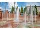 Interactive fountain and splash park offering recreational Gathering fun in a landscaped green space at 1258 Ainsworth Aly # 46, Sugar Hill, GA 30518