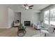 Cozy living room with modern fireplace and hardwood floors at 1258 Ainsworth Aly # 46, Sugar Hill, GA 30518