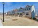 View of the front of the gray two-story brick and siding townhomes at 1258 Ainsworth Aly # 46, Sugar Hill, GA 30518