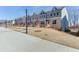 View of the front of the gray two-story brick and siding townhomes at 1258 Ainsworth Aly # 46, Sugar Hill, GA 30518